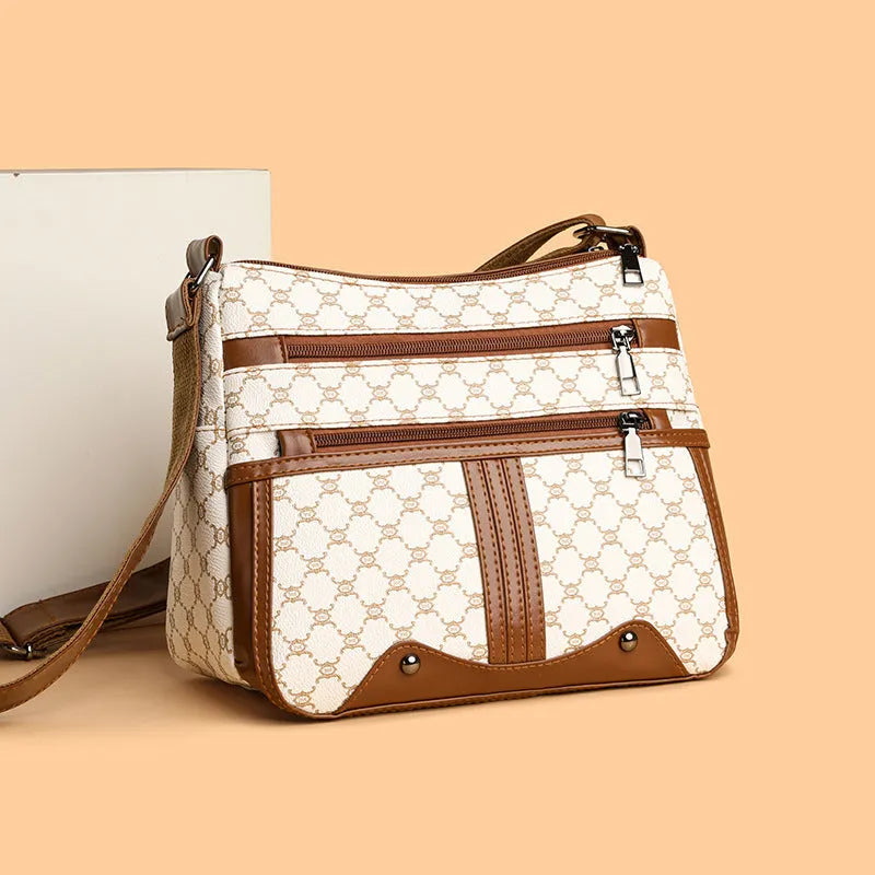 Brown women's crossbody bag with textured stitching pattern and adjustable strap showing interior polyester lining