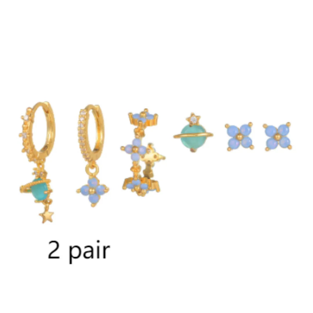 Gold and silver floral ear studs with zircon mosaic details in Japanese Korean style.
