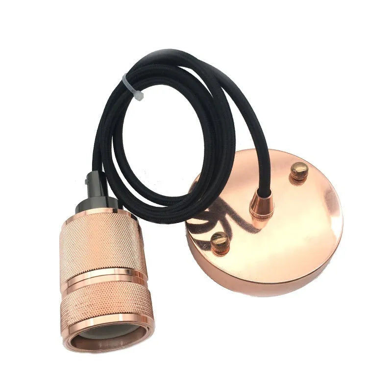Components of a DIY retro ceiling light assembly kit in chrome finish, showing metal ceiling rose, braided cord, and lamp holder.