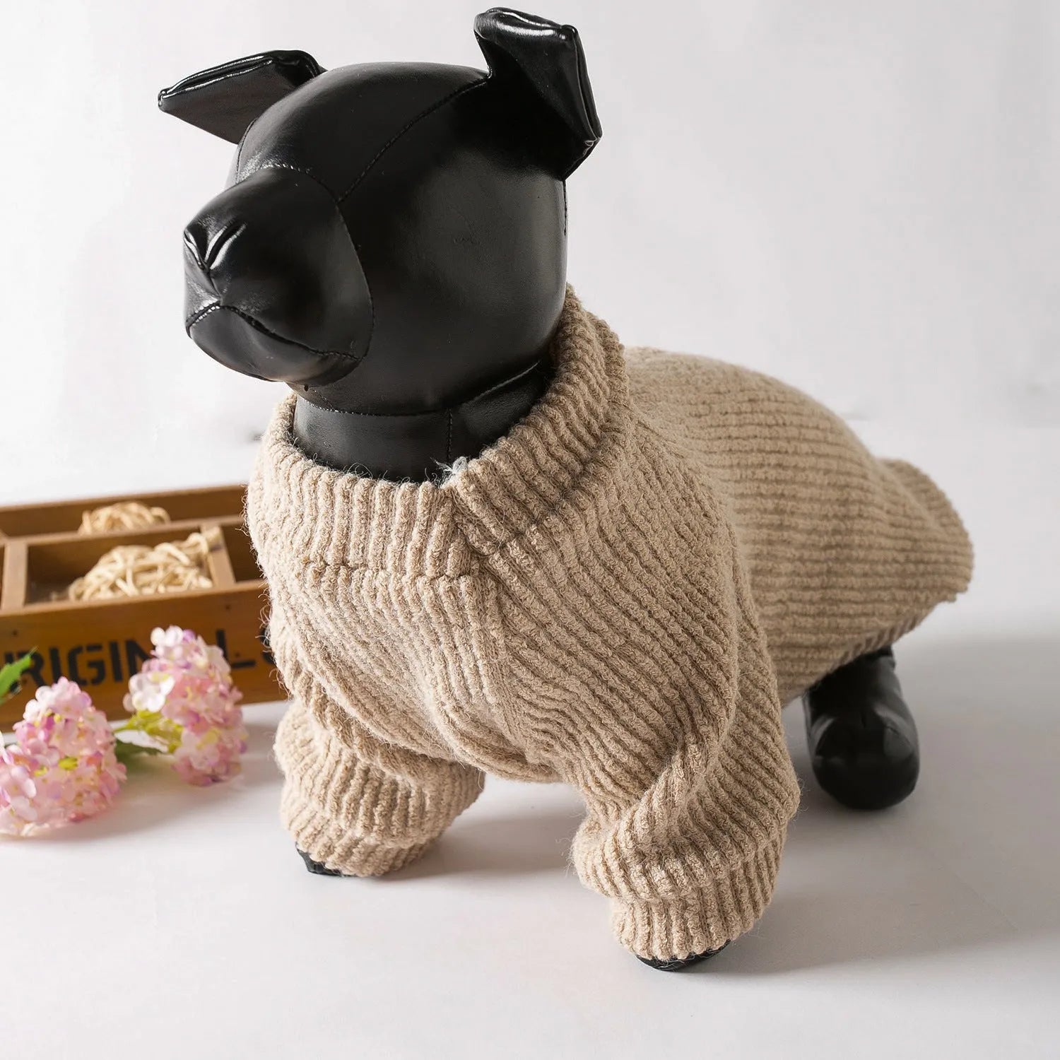 Brown cloth dog pullover sweater on a small white dog, showing casual style.