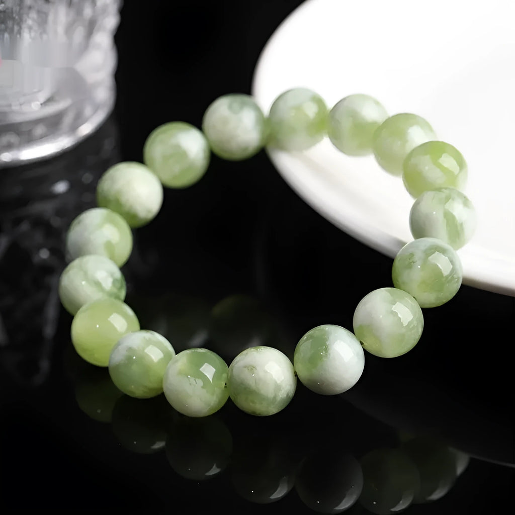 Green milk-in-water Xiuyan jade bracelet with polished finish and geometric unisex styling