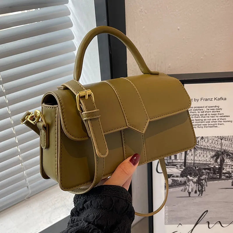 Women's beige messenger bag showing file compartment and sandwich pocket exterior
