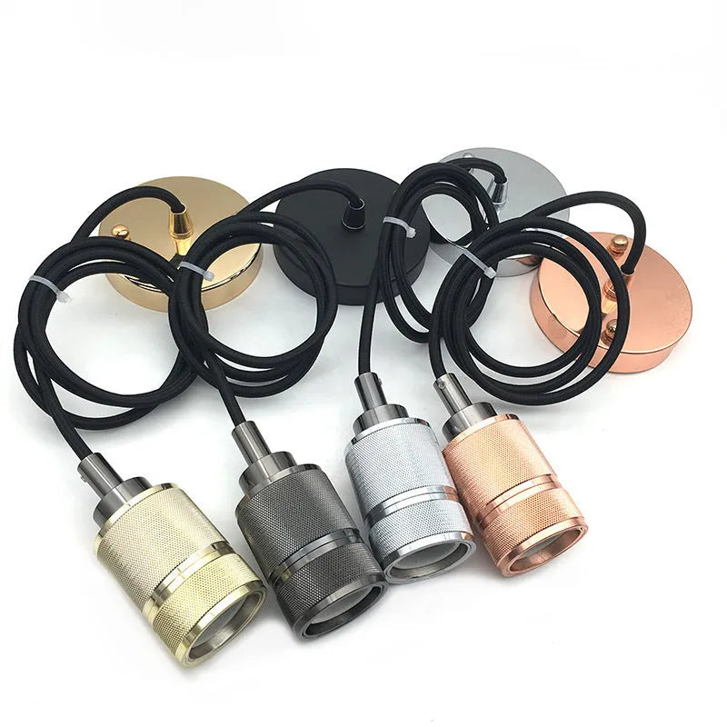Components of a DIY retro ceiling light assembly kit in chrome finish, showing metal ceiling rose, braided cord, and lamp holder.