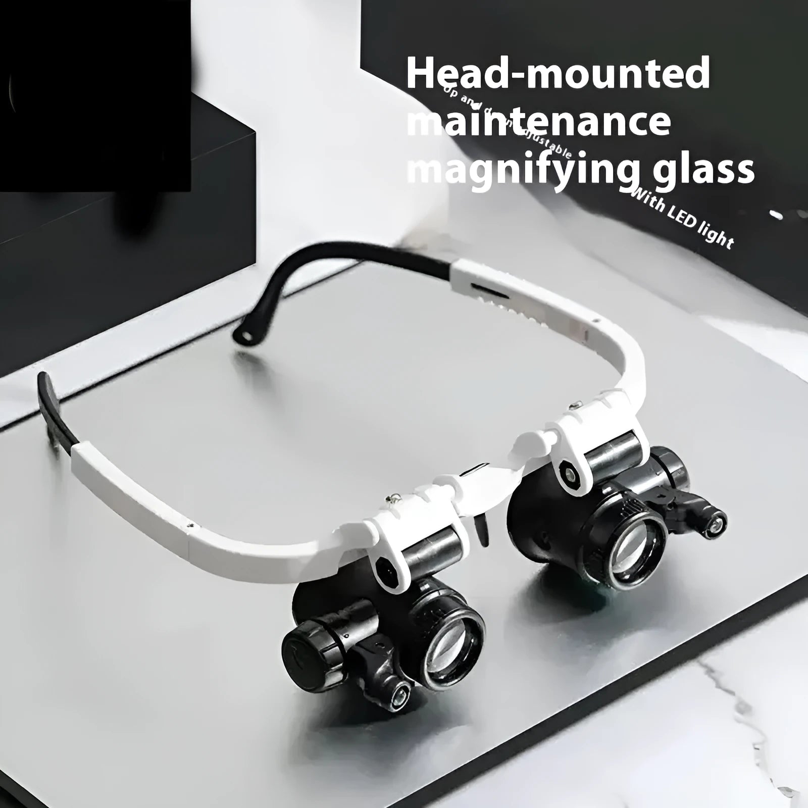 White head-mounted magnifying glass with LED light, shown folded and unfolded on a workbench.