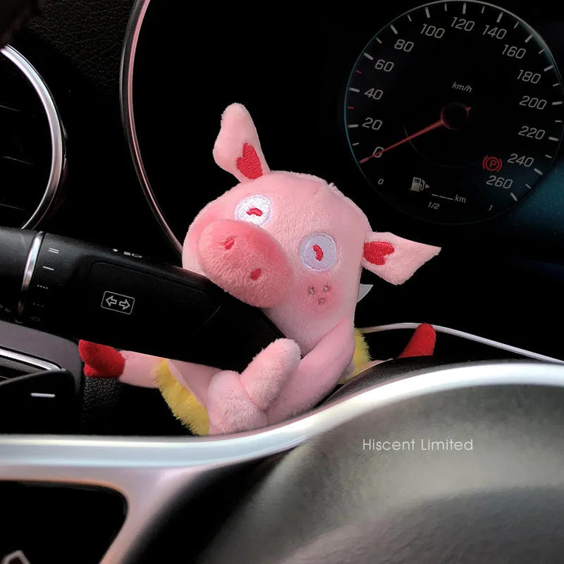 Cute cotton car decoration doll showing a pilot dog design on a dashboard.