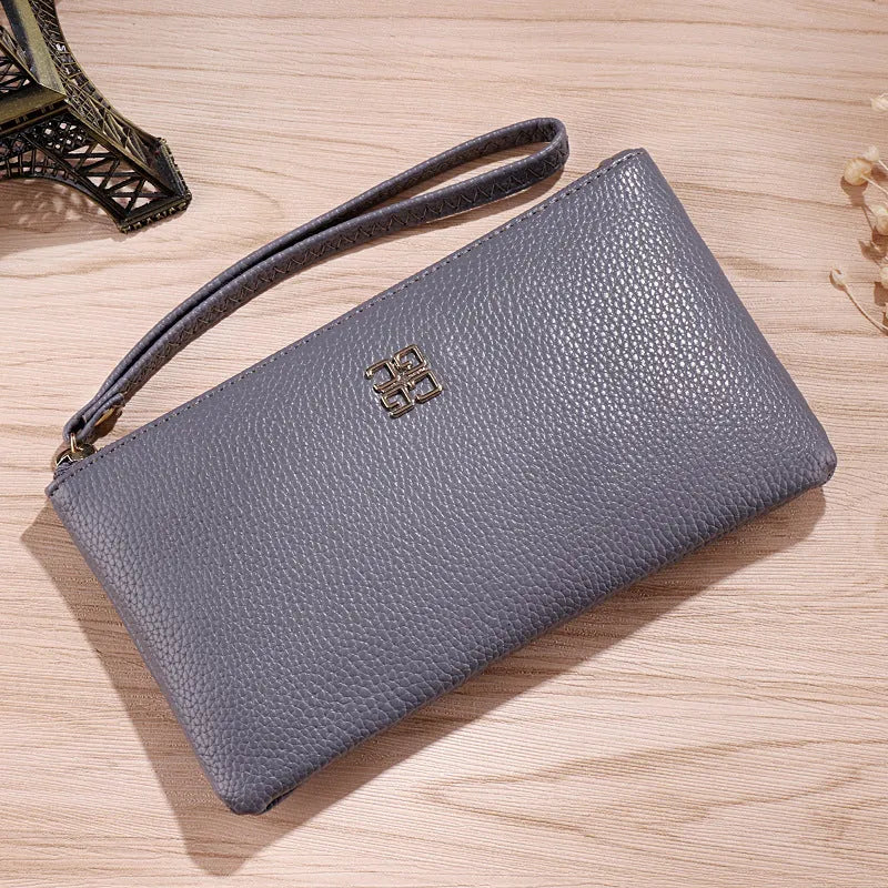 Long wine red PU leather wallet handbag with a zipper and visible sewing lines, laid flat to show its 55-inch length.