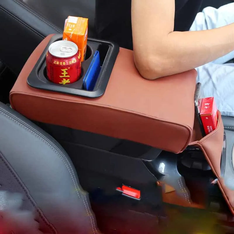 Beige leather car armrest box with water cup holder on a car centre console