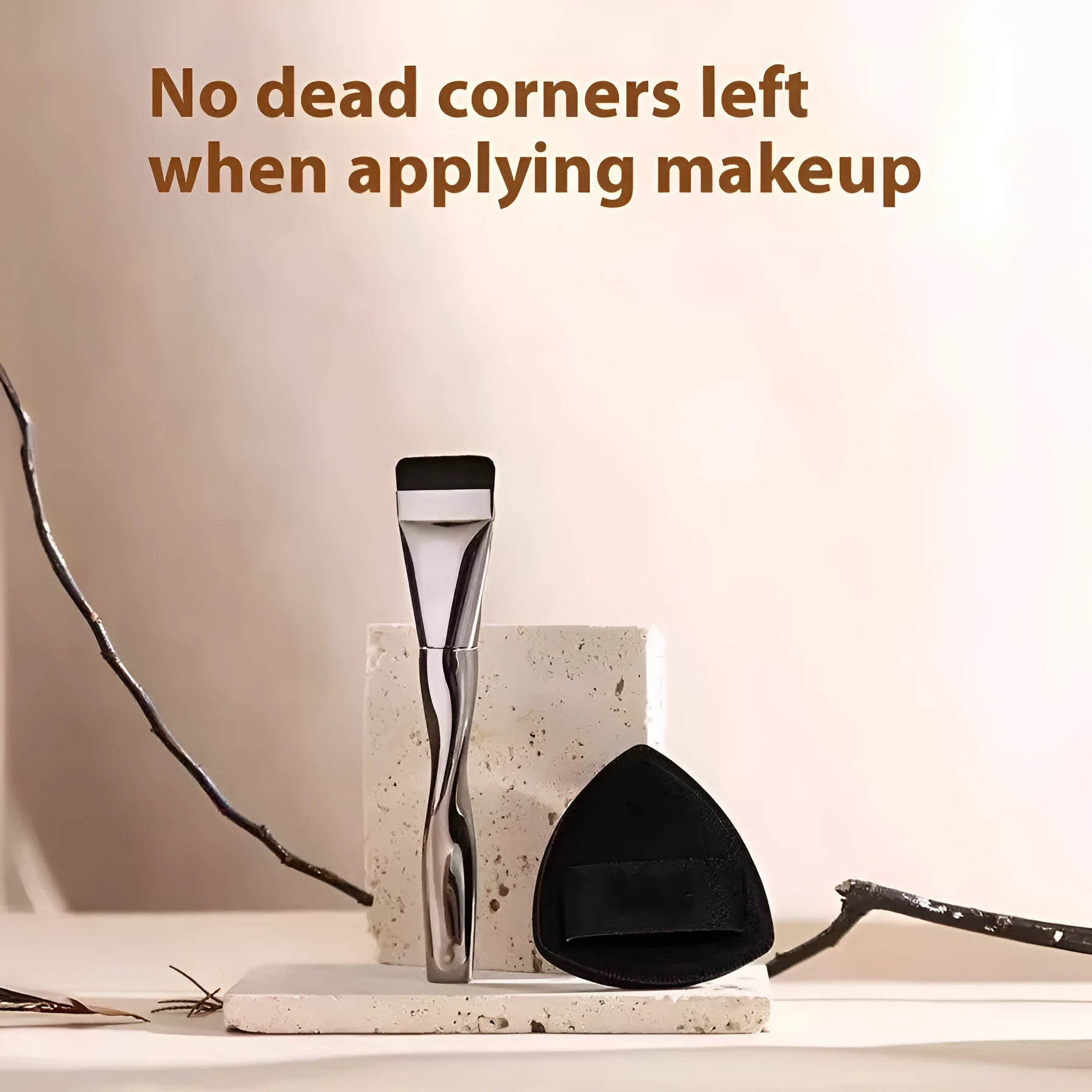 Spiral one-shaped black powder foundation brush with long handle on a white surface next to its storage bag.