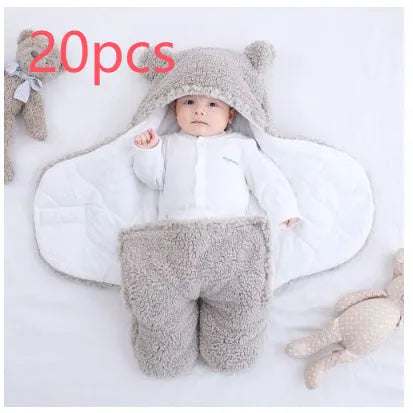 Cotton blend baby quilted sleeping bag wrapper in light blue, shown with size labels for 3M, 6M, and 9M.