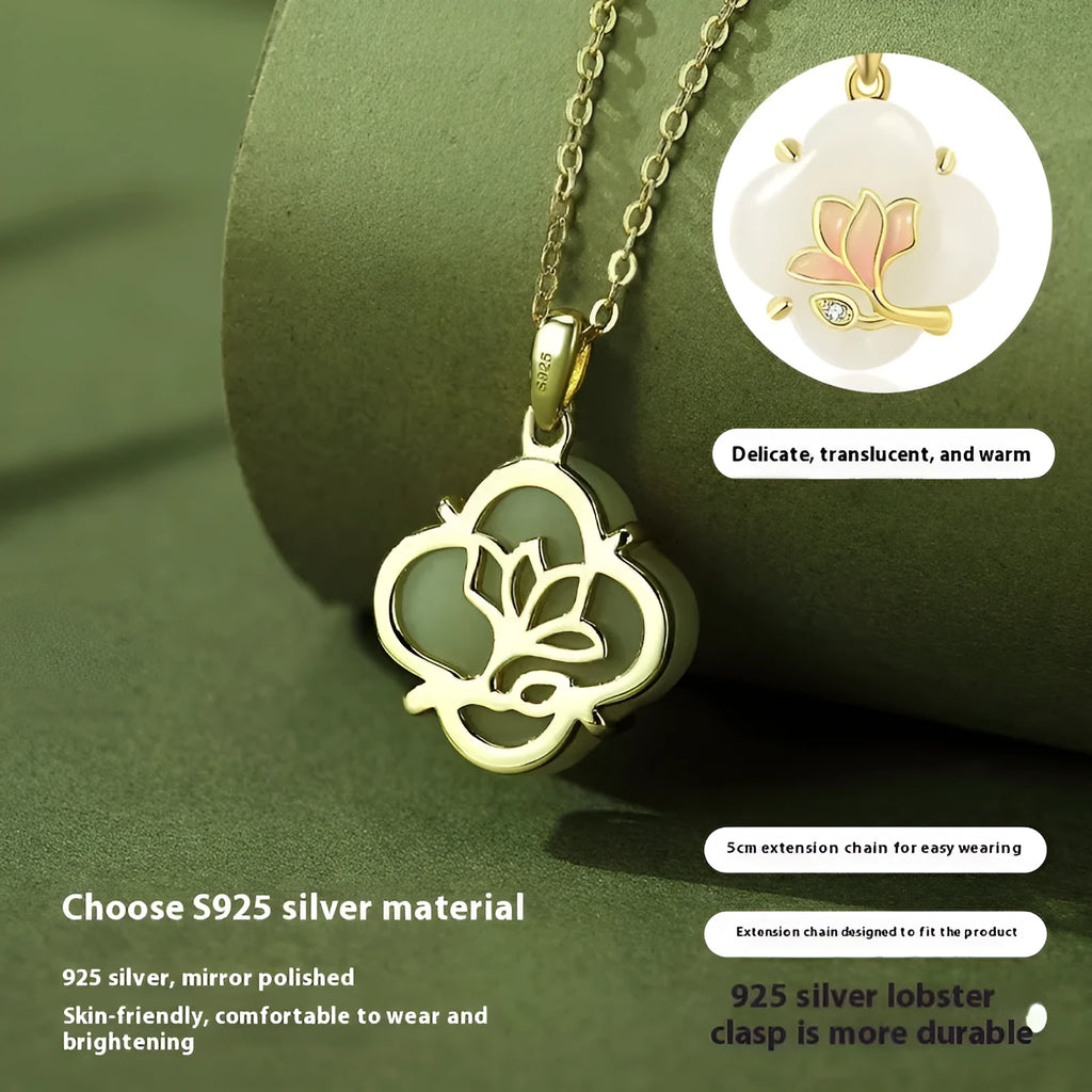 Magnolia flower Hetian jade and sterling silver necklace, bracelet, and earrings set on a white background.