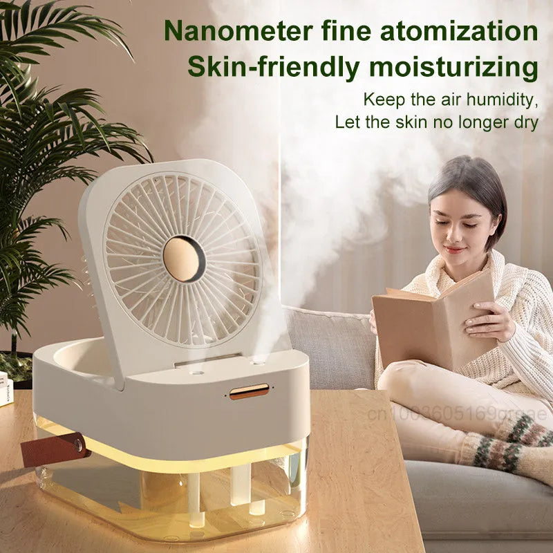 White or green USB desktop humidifier fan with remote control on a wooden desk.