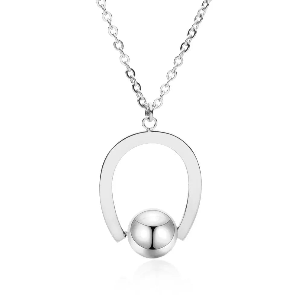 Adjustable stainless steel necklace with a geometric pendant on a cross chain in gold or silver.