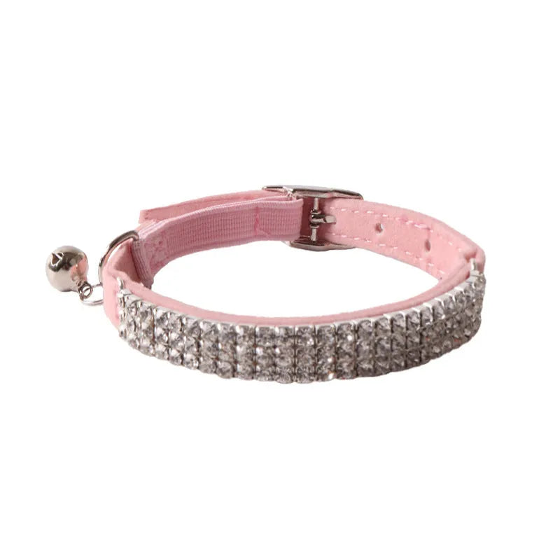 Elastic buckle cat collar in flocking fabric with gang drill detail, shown in multiple colours.