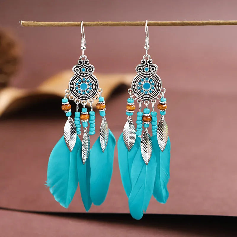 Bohemian style round drop feather earrings with leaf design in alloy, showing electroplated finish.