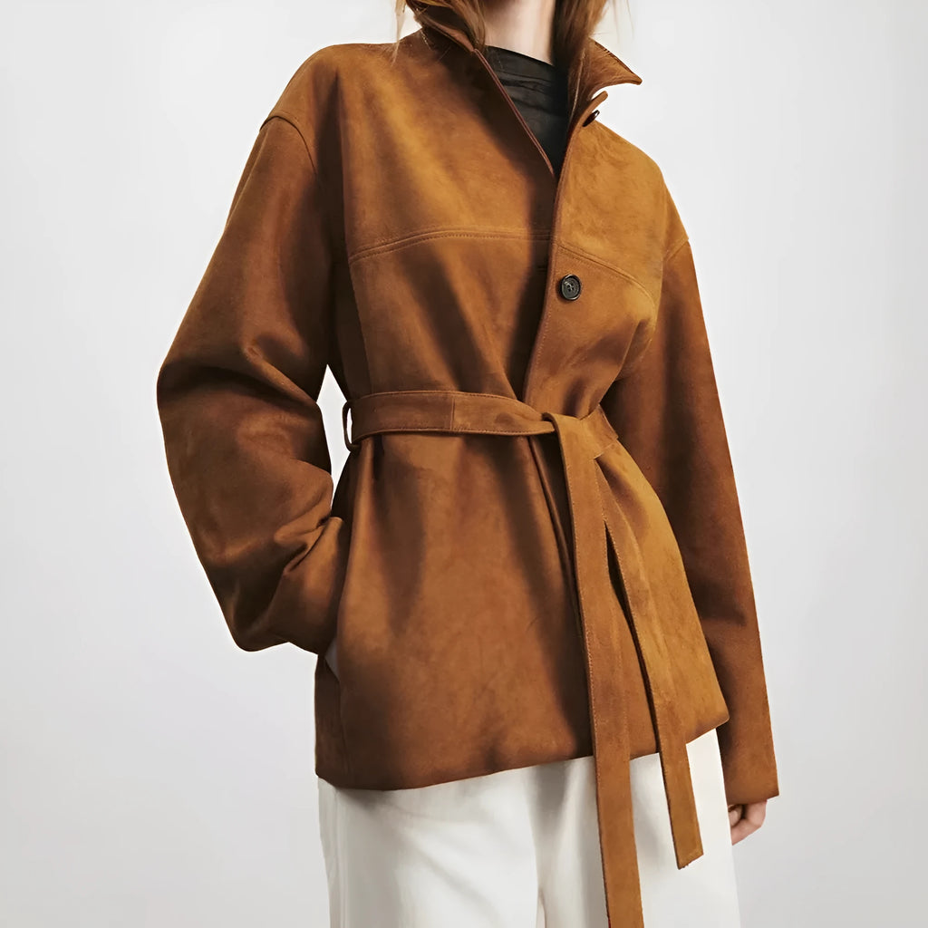 Yellow brown mid-length cashmere coat with a Peter Pan collar and decorative leather stitching on the front.