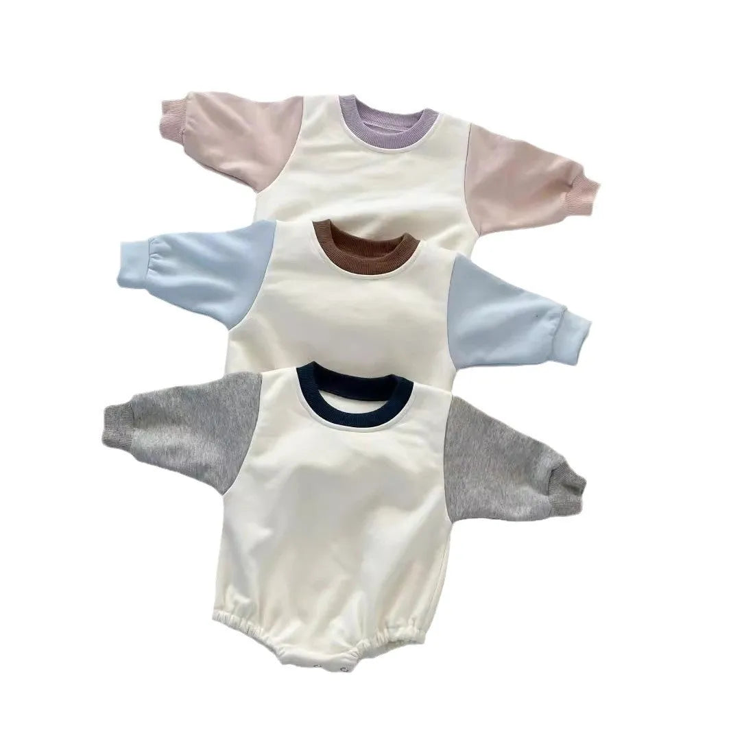 Baby romper in cotton triangle jumpsuit style with hidden hook closure, autumn weight, available in multiple colours