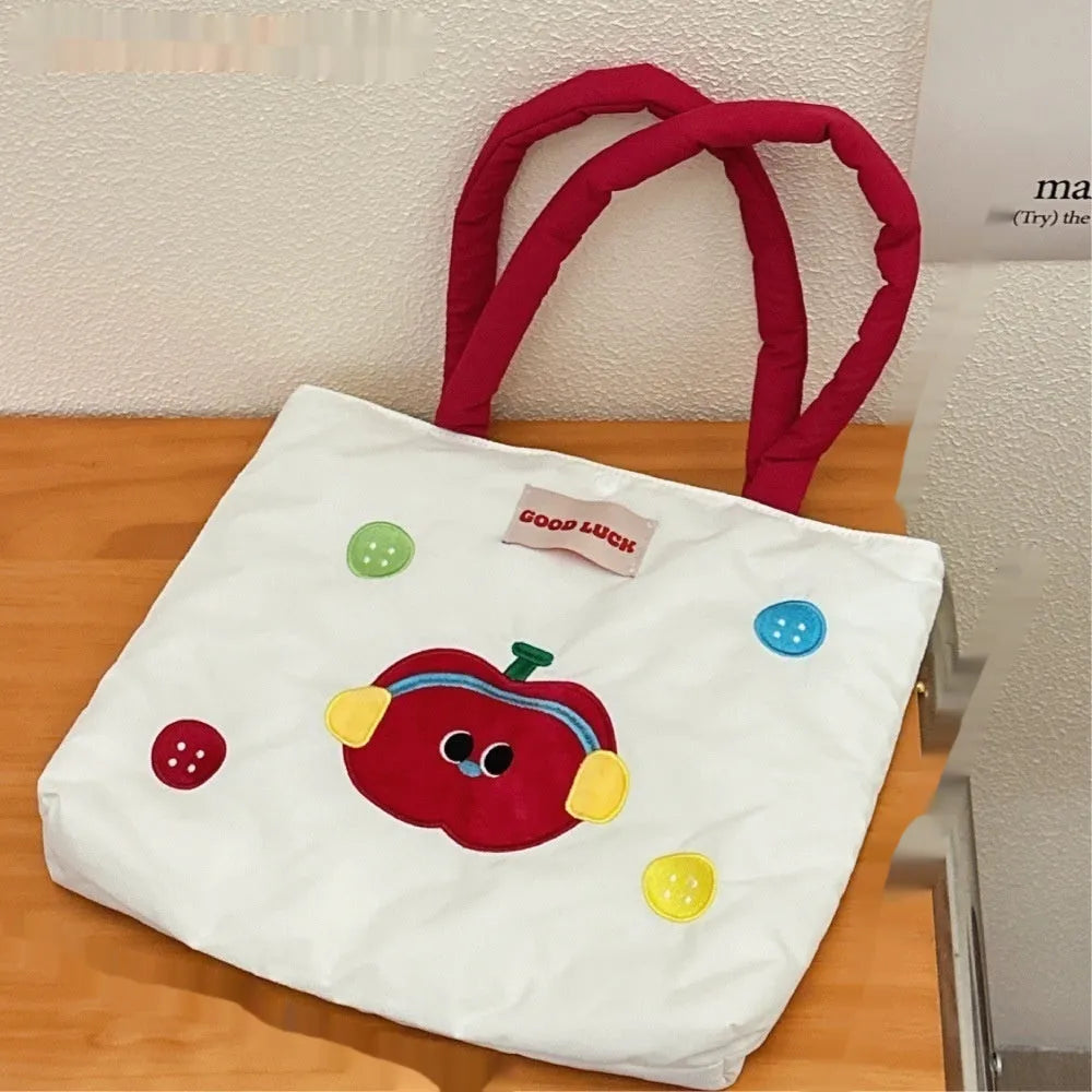 Cartoon print canvas handbag showing colourful design with 30x36x24cm dimensions
