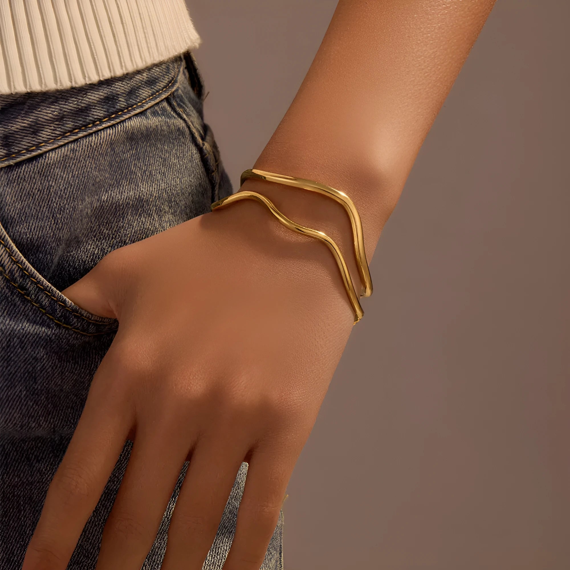 Niche Minimalist Open-end Gold Ripple Line Bracelet on wrist showing ripple texture and electroplated finish.