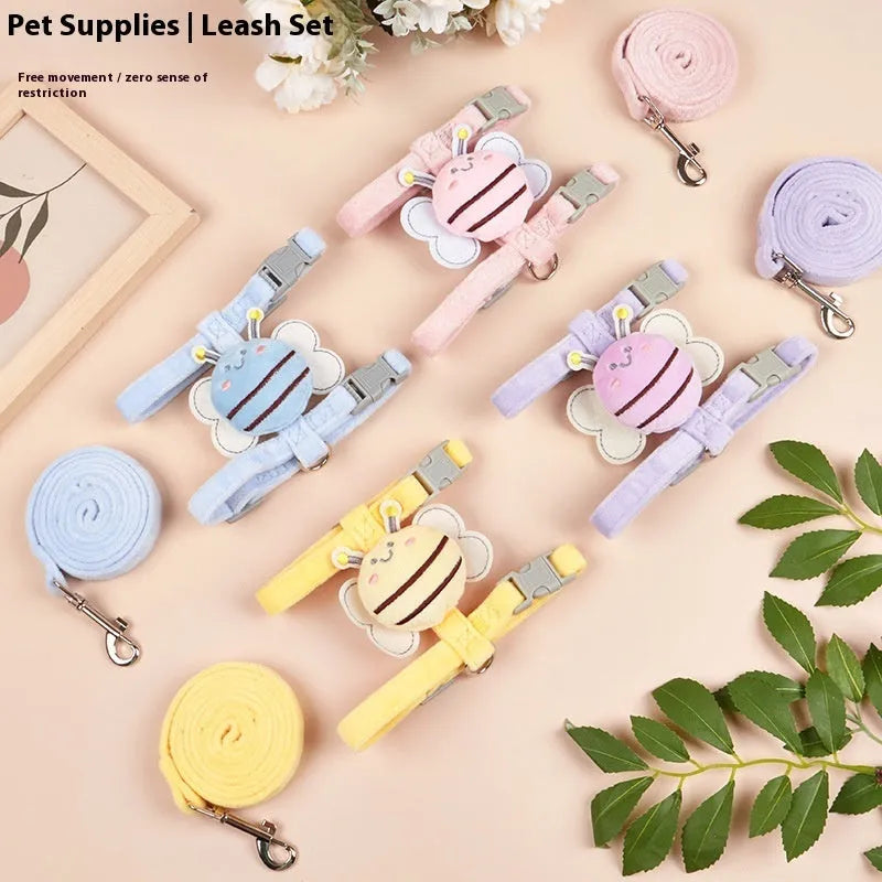 Pink adjustable bee-shaped cat leash with a teddy texture handle for outdoor walks.