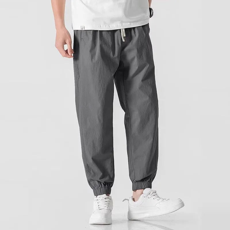 Men's fashion loose cuffed cargo pants in khaki, polyester fabric, autumn casual trousers with cuffed hem