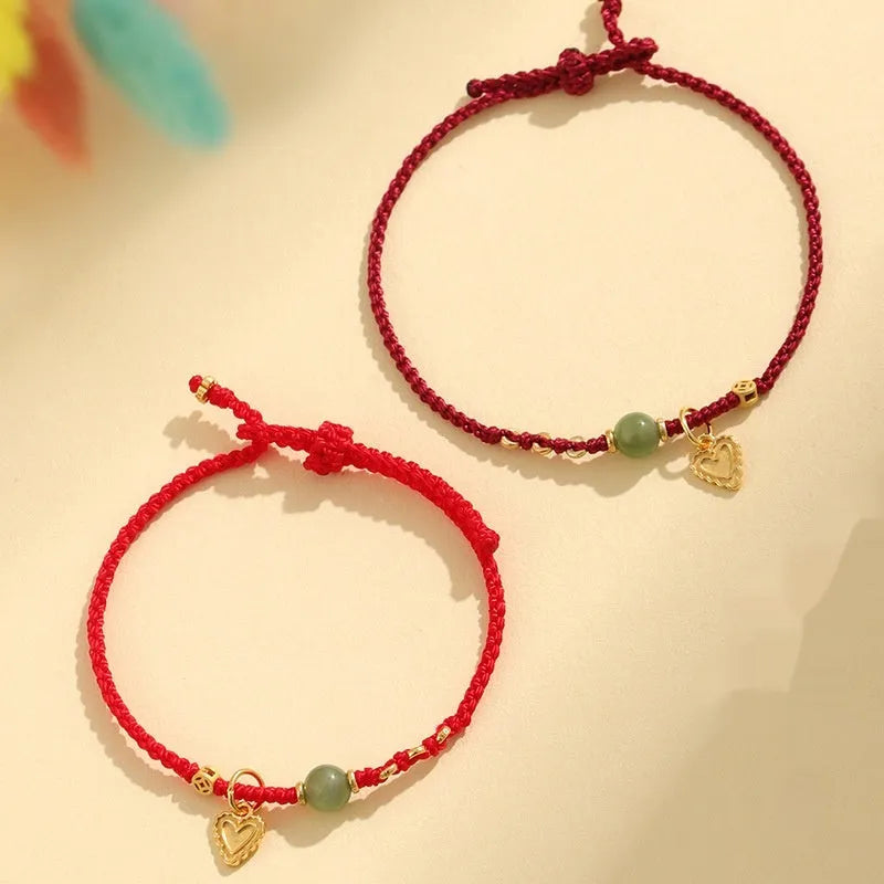 Handmade 925 silver bracelet with Hetian jade stone in woven design, available in red or dark red strap options