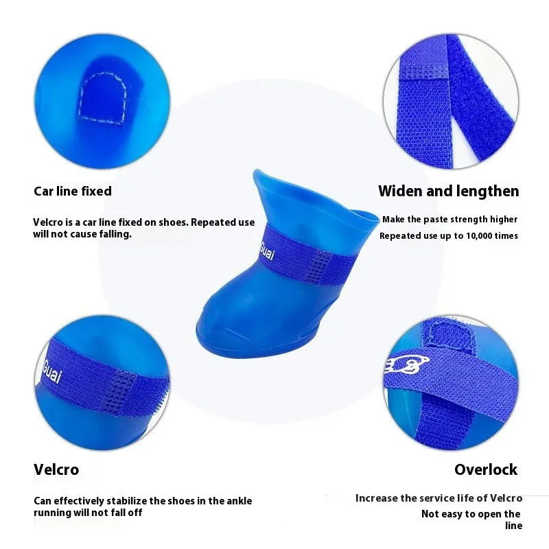 Set of four colourful rubber dog rain shoes with anti-slip soles on a wet surface.