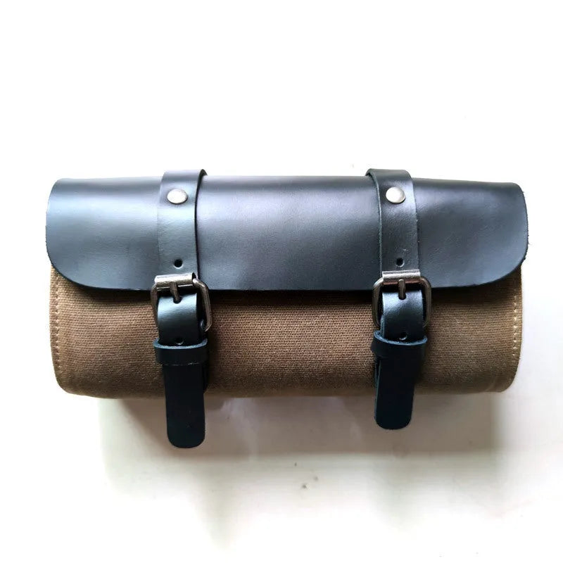 Camel Bag Knight cotton messenger bag in army green with rivet details, showing internal zipper and phone pockets.