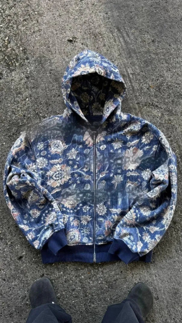 Man wearing a loose-fitting blue hooded zip coat with long sleeves for casual autumn wear.