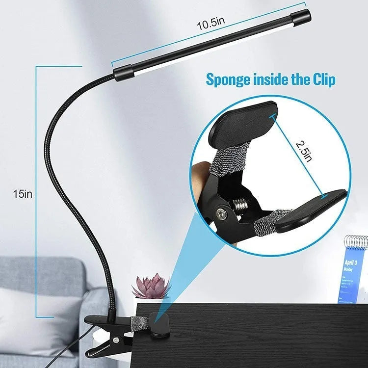 Black and white USB-powered LED desk lamp with a 26 cm length on a desk.