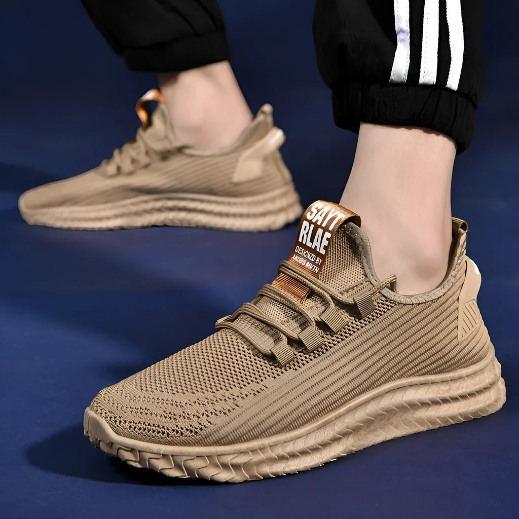 Men's casual shoes with black flying weave upper, rubber sole, and front tie lacing