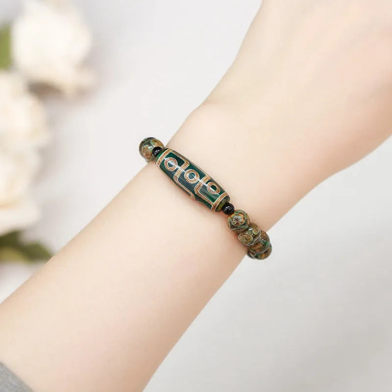 Handmade barrel shaped Dzi bead bracelet in green with geometry design