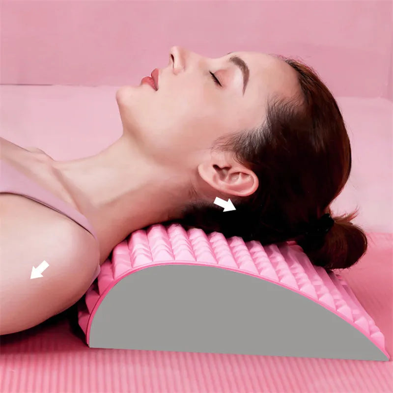 Blue back stretcher pillow for lumbar and neck support on a grey background.