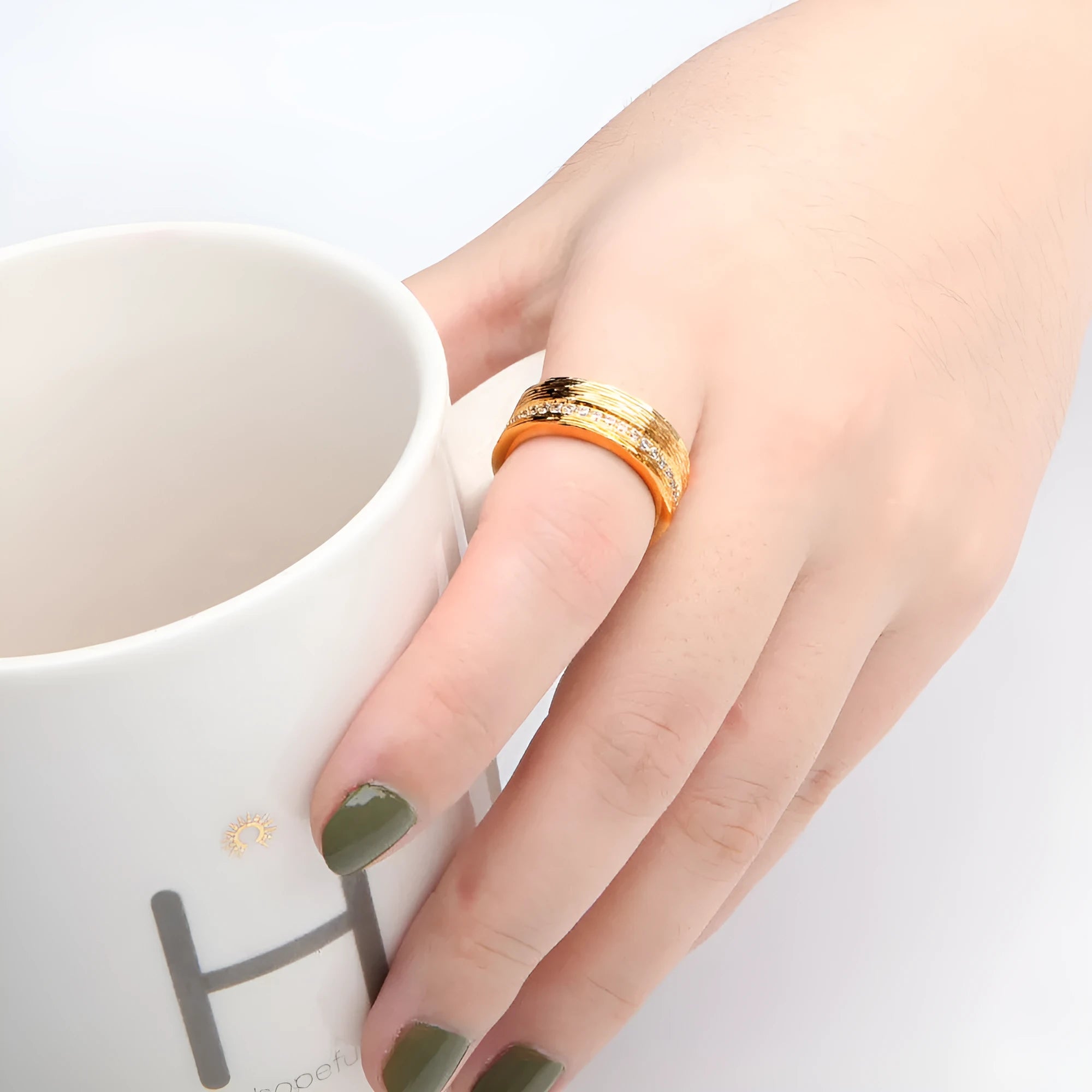 Gold geometric copper zircon ring for women on a white background.