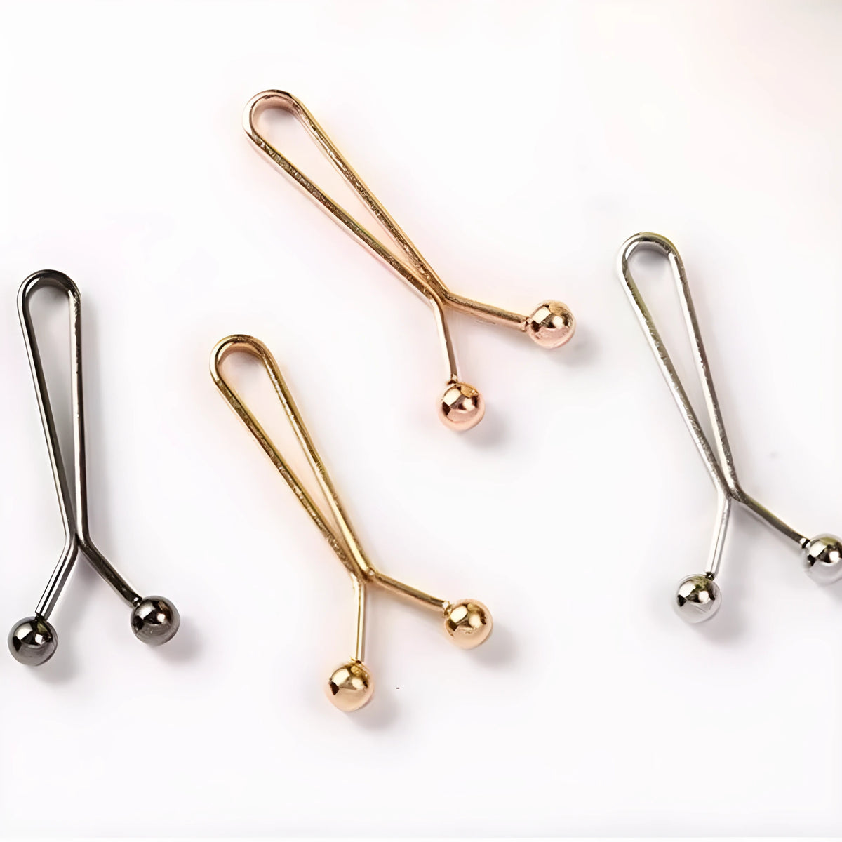 Iron scarf clip with electroplated finish in rose gold colour on a silk scarf