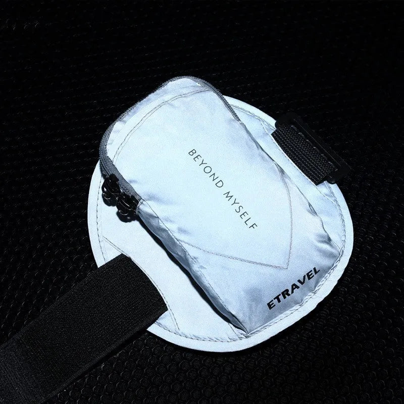 Black reflective running arm bag with adjustable strap, shown holding a mobile phone, designed for outdoor sports.