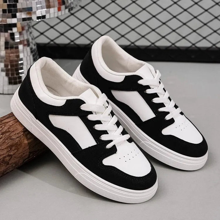 Black women's casual sports shoes with flat rubber sole and lace-up front