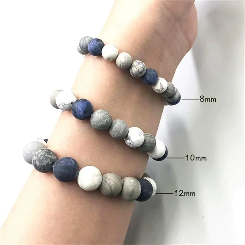 Handmade planet stone men's bracelet in U-shape, S228 Universe Wind design on wrist.