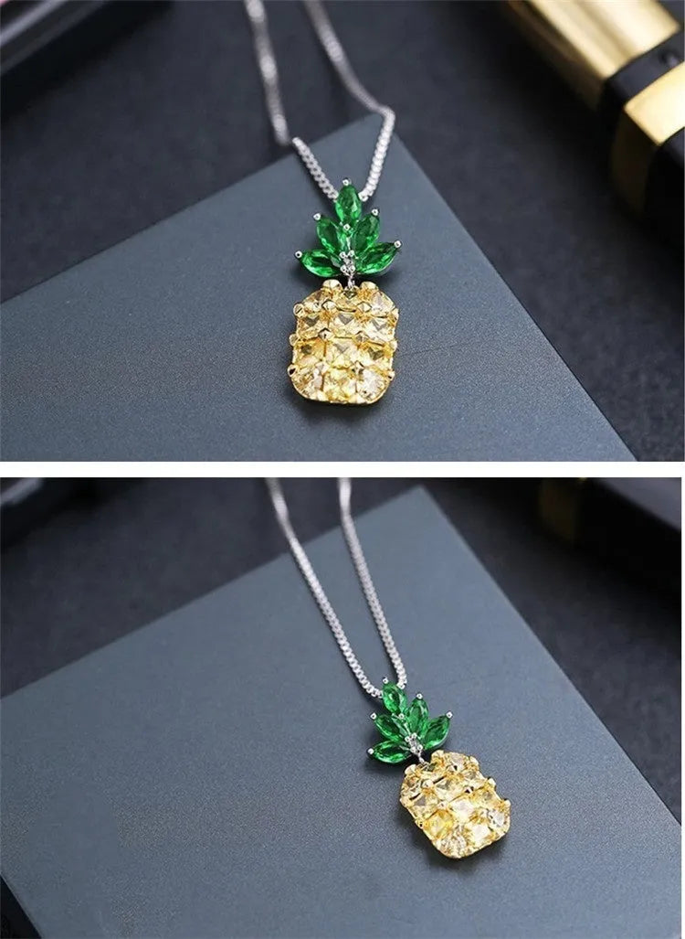 Silver geometric pineapple pendant necklace with a diamond accent on a model