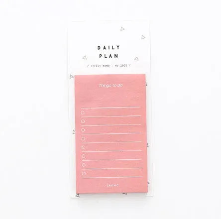 Pink and red schedule planning notepads showing 10cm by 6cm size and 80g paper.