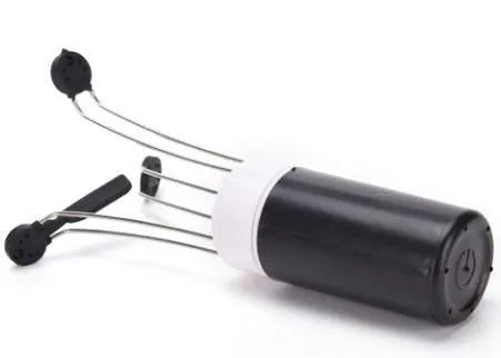 White and black automatic stirrer blender on a kitchen counter