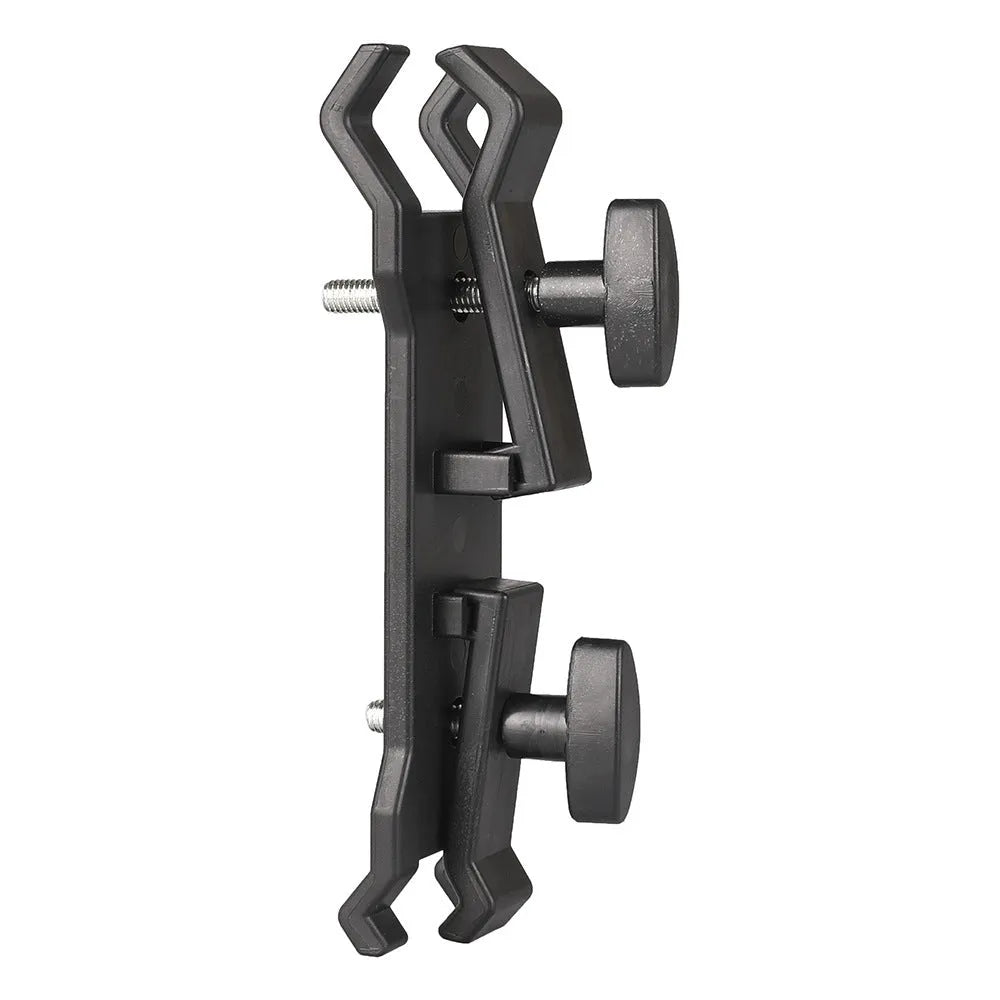 Black ABS plastic umbrella clip mounted on a camera tripod head.