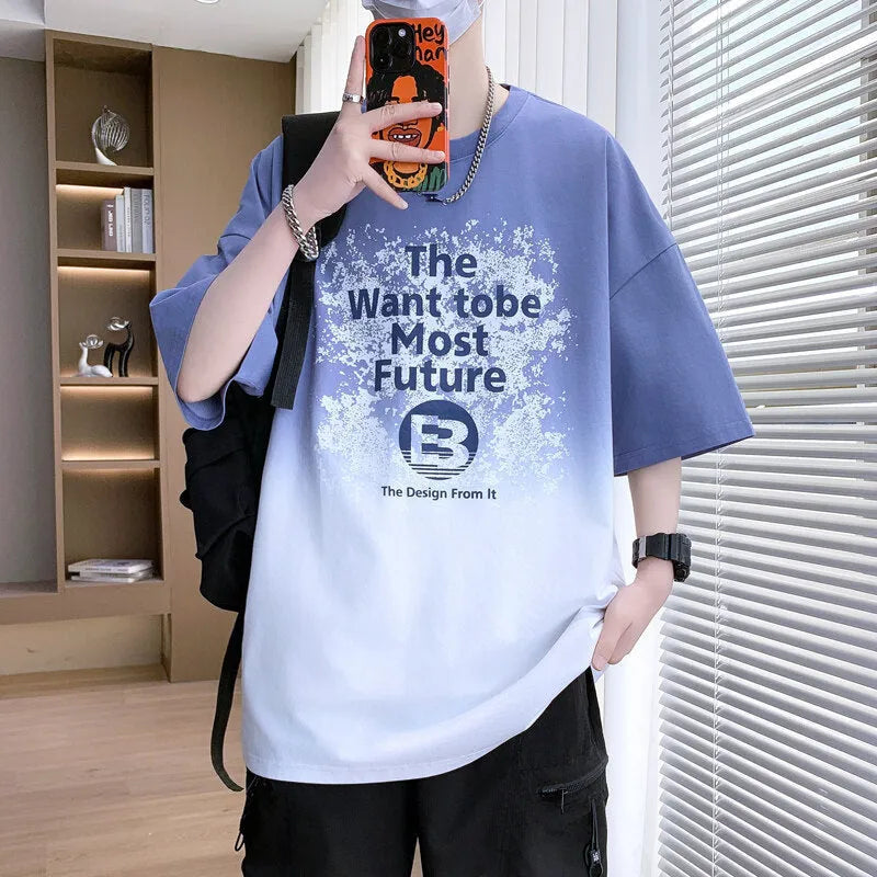 Boy wearing a dark blue youth T-shirt with a printed text pattern and drop-shoulder sleeves