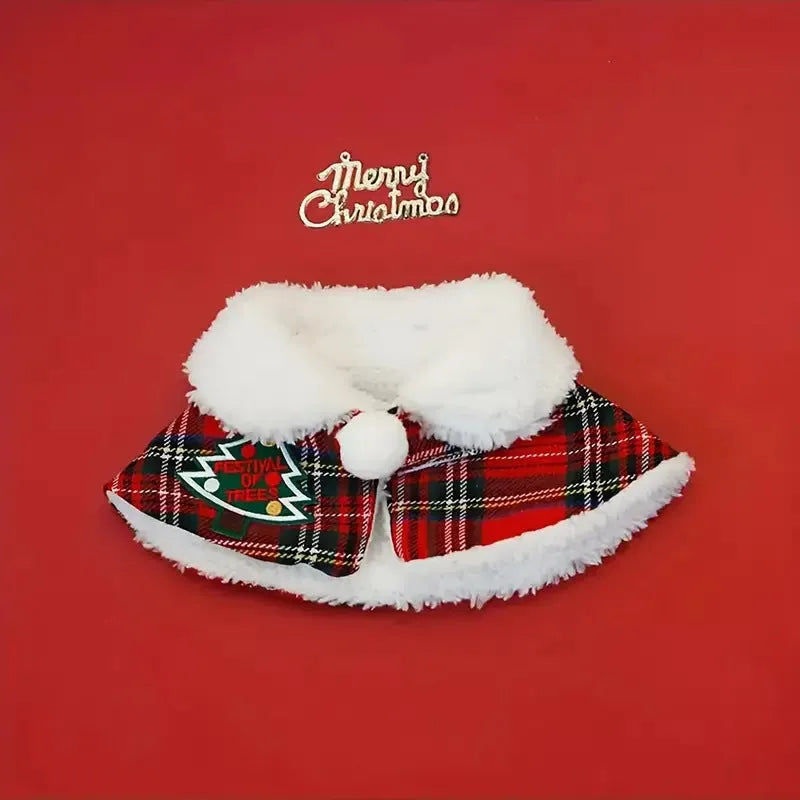 Red festive dog scarf with bell pattern fastened around a small dog's neck in winter.