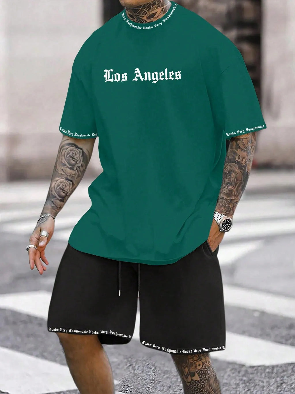 Men's blue sports style short-sleeved top and matching shorts laid flat