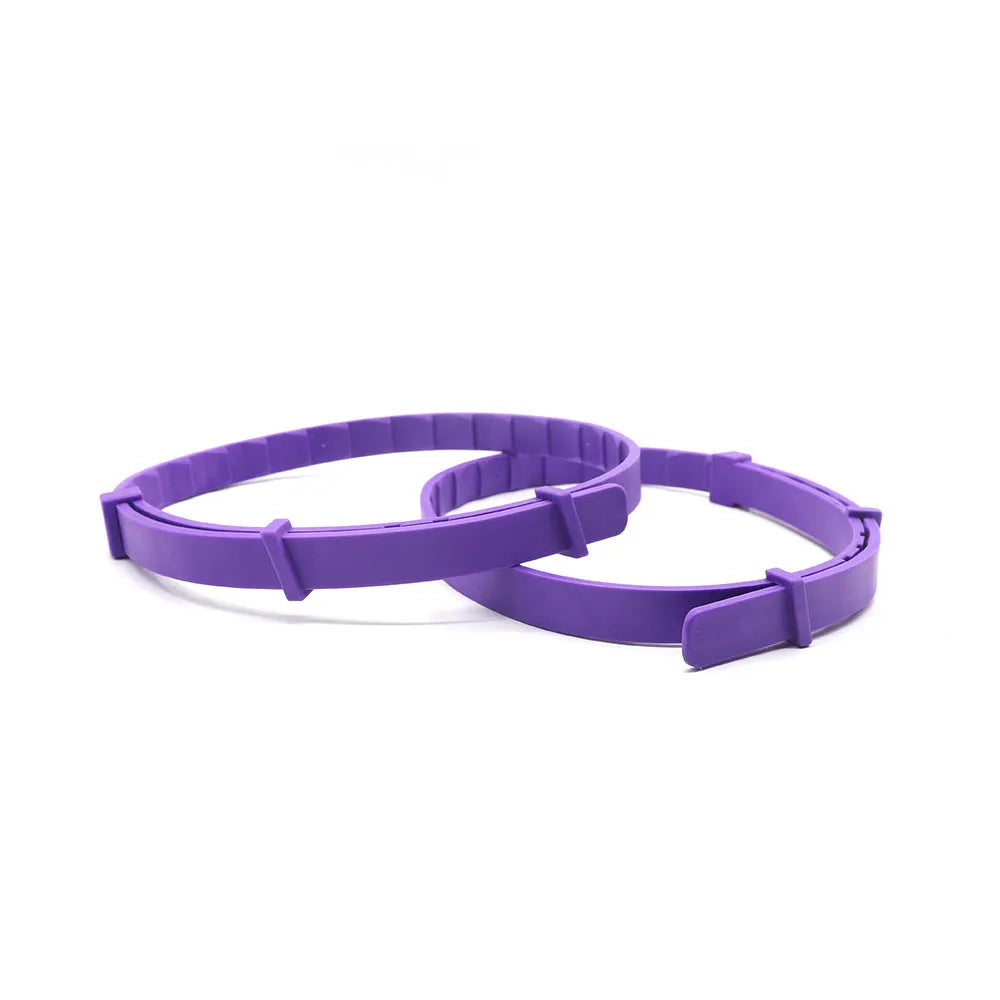 Four-pack of monochrome patterned dog anxiety relief collars in assorted colours on a white background.