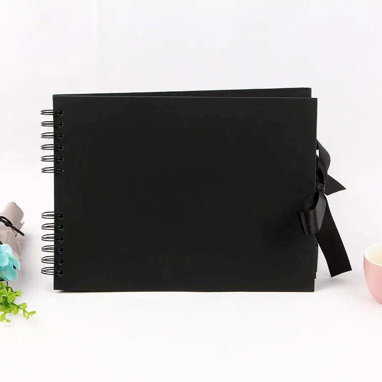 Yellow and black handmade DIY photo album with coil binding, sized 290mm by 215mm.