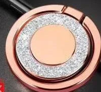 Sparkling bling glitter metal phone holder ring showing rotation, attached to a smartphone.