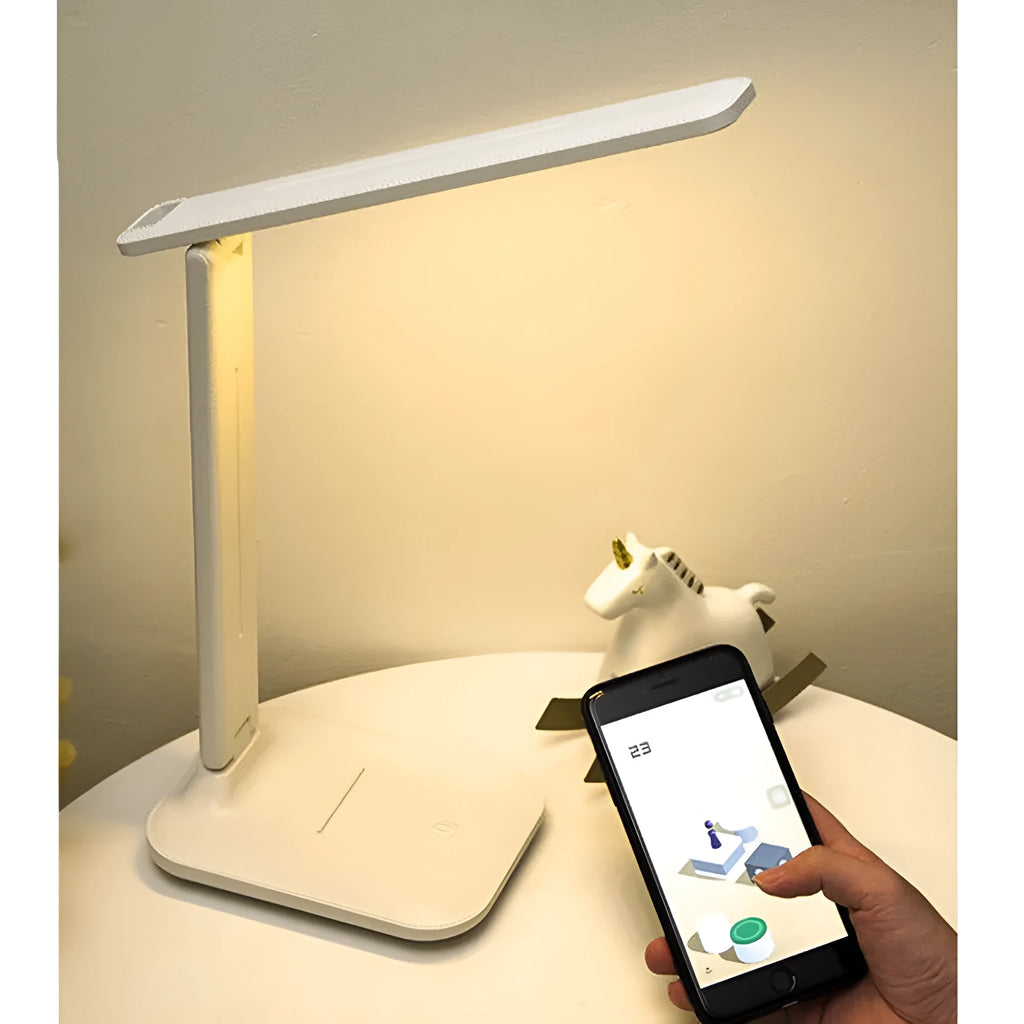 White plastic children's bedside lamp with touch dimming control and USB charging port.