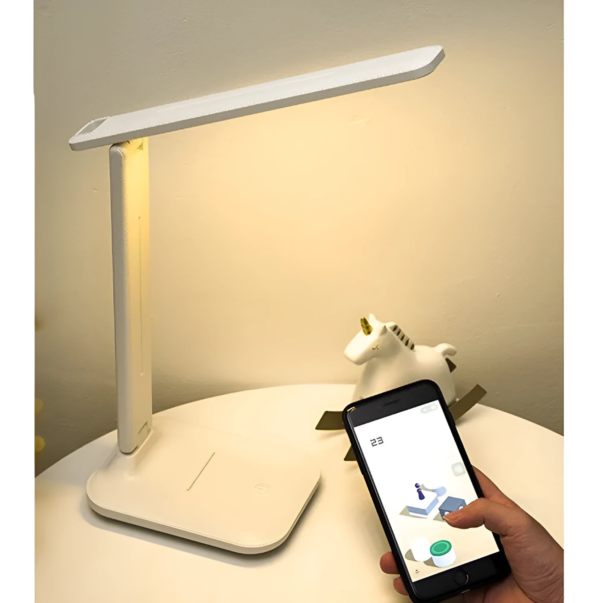 White plastic children's bedside lamp with touch dimming control and USB charging port.