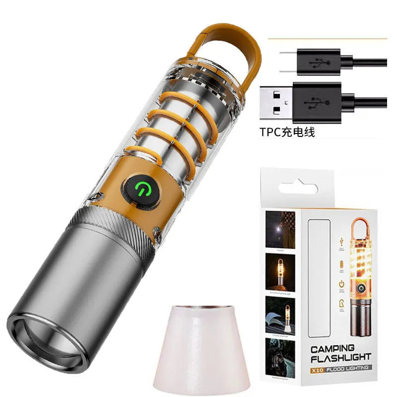 Orange 10W LED torch with optical zoom lens and keychain, shown with USB charging cable.